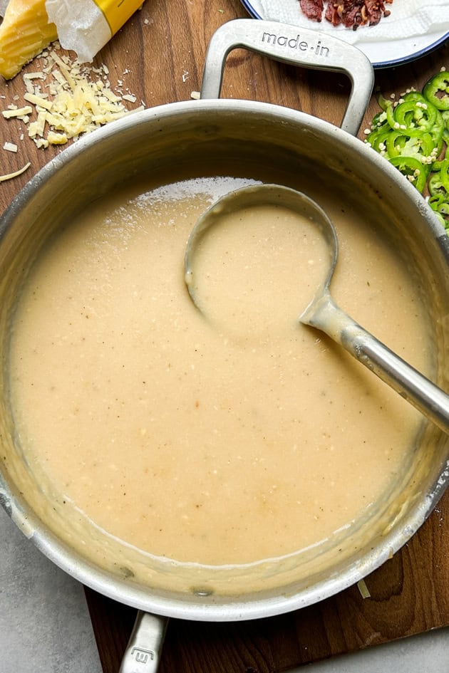 Potato Soup in a pot with a ladle