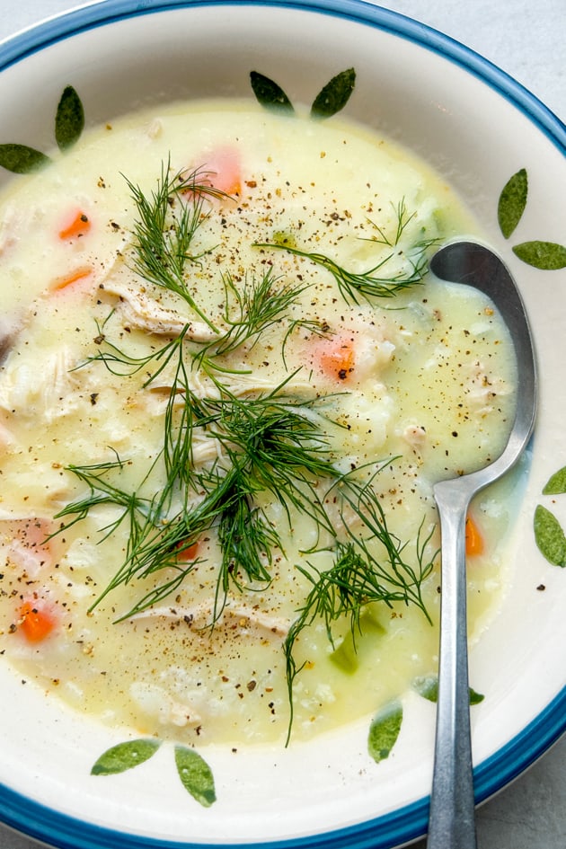 Greek Lemon Chicken Rice Soup (Avgolemono Soup) with fresh dill and black pepper